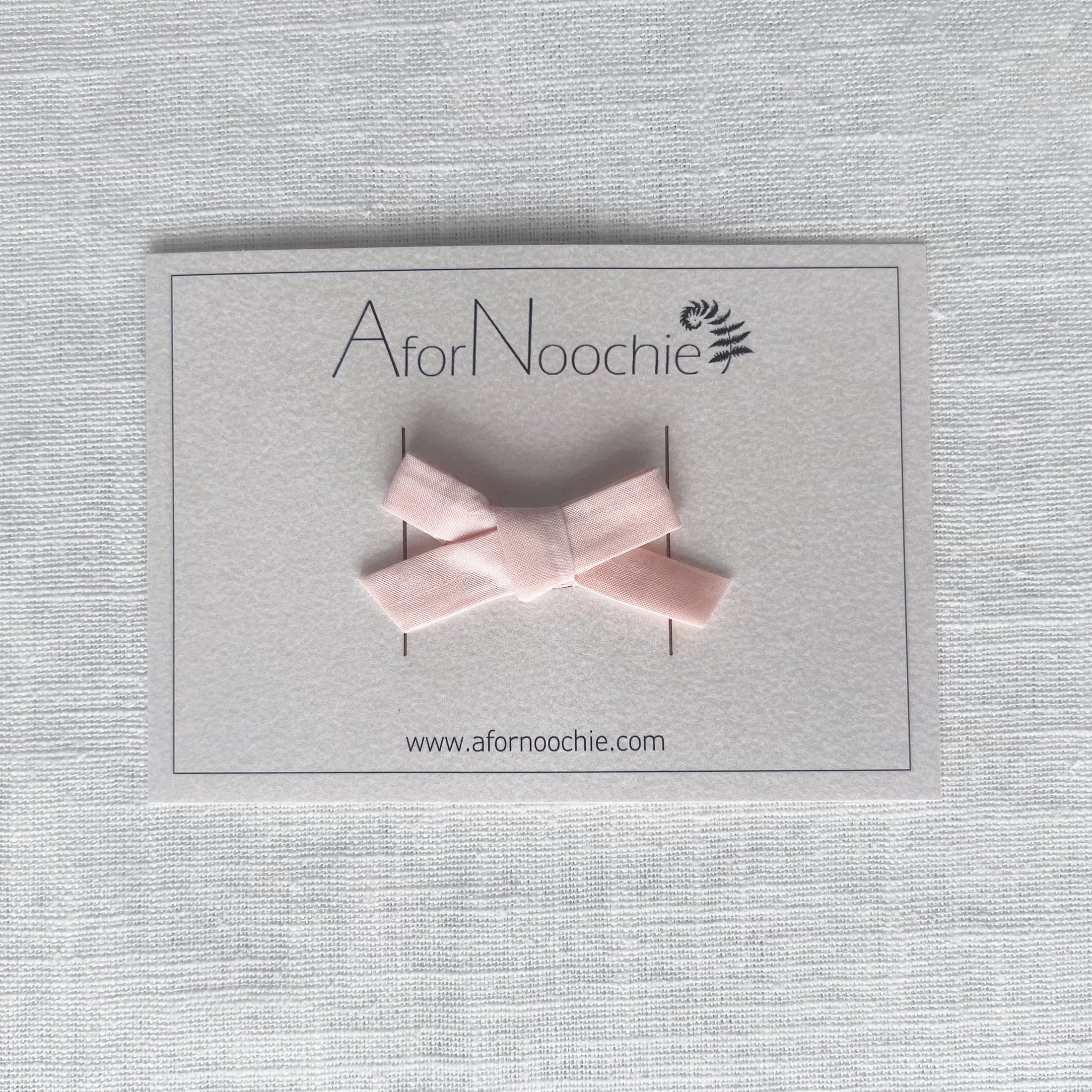 Mini bow hair clips in Liberty of London plain colours