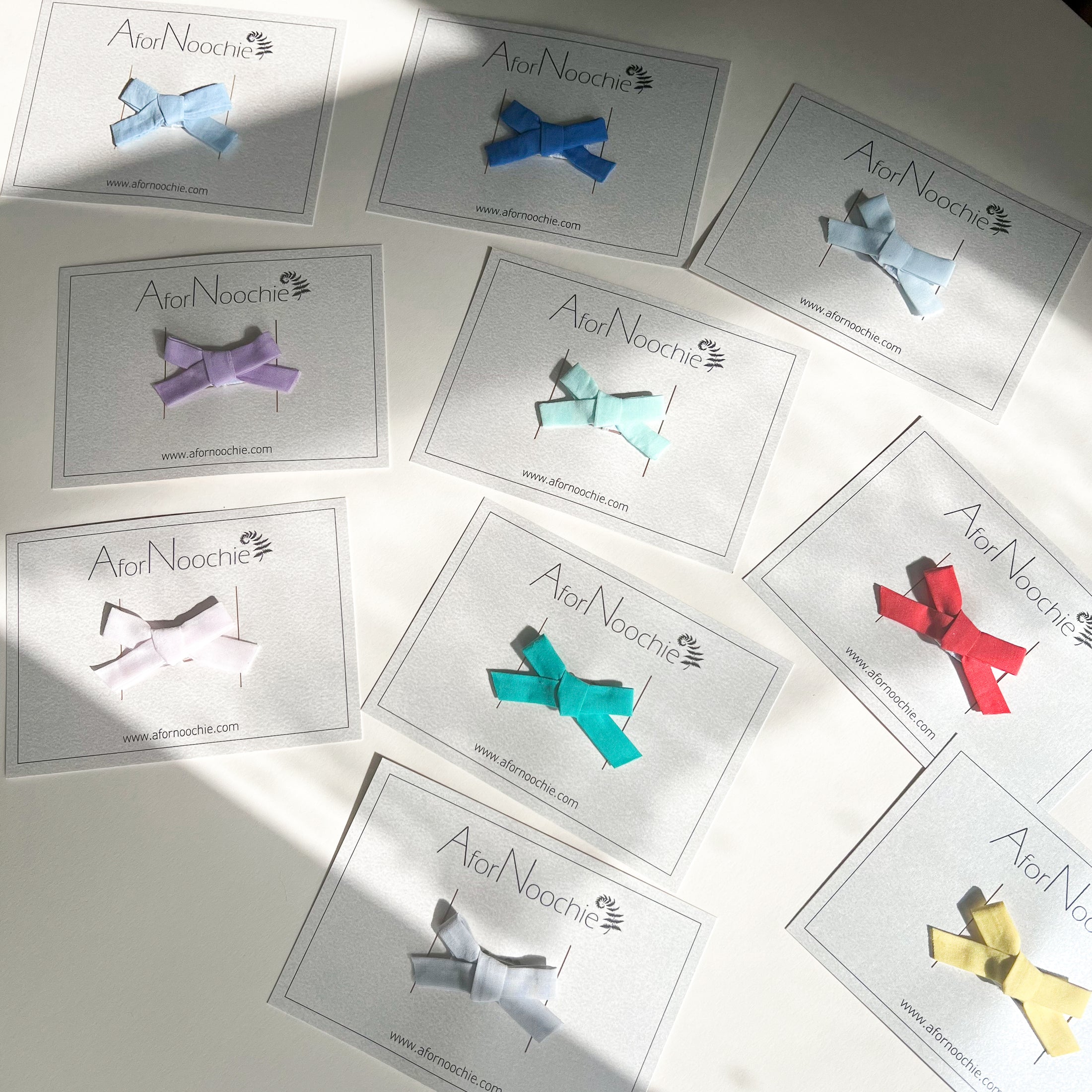 Mini bow hair clips in Liberty of London plain colours